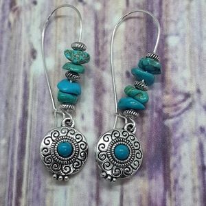 Tibetan silver pendant drop earrings with turquoise chip beads.